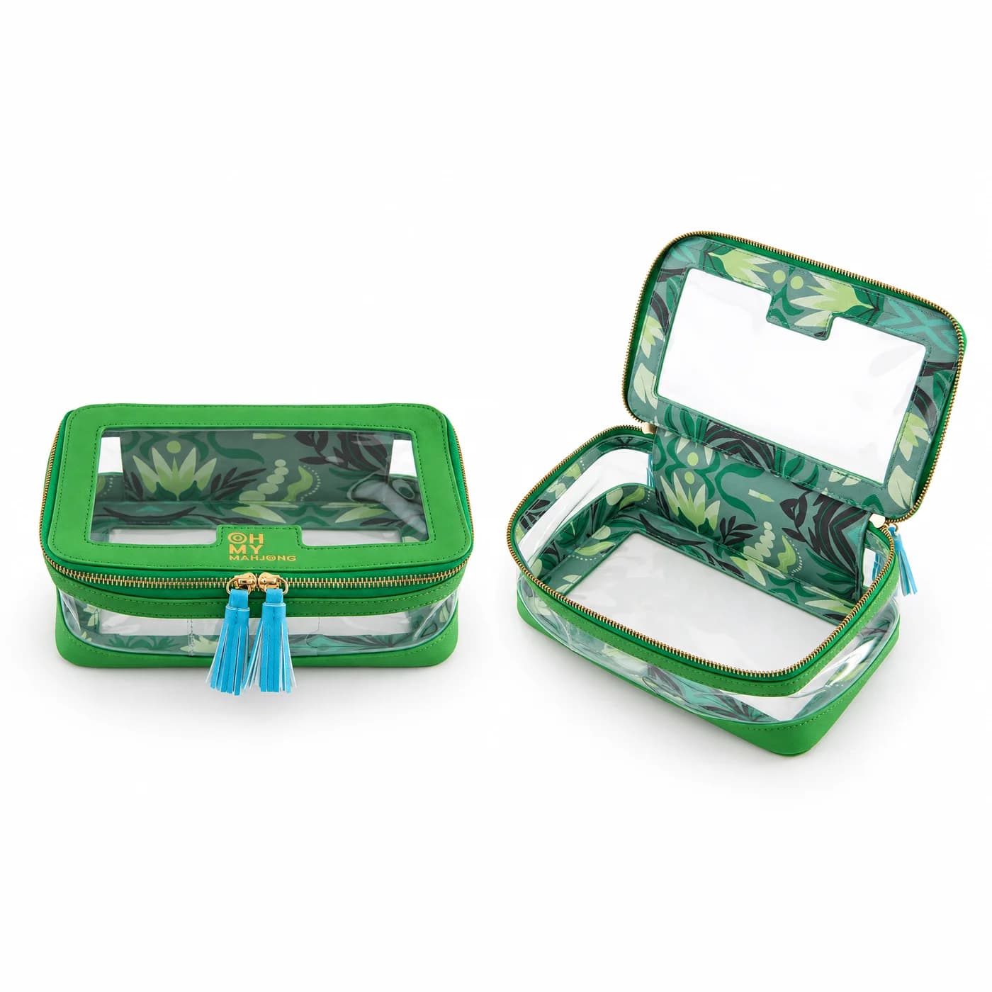 Kelly green tile travel case with clear panels, gold zippers and blue tassels