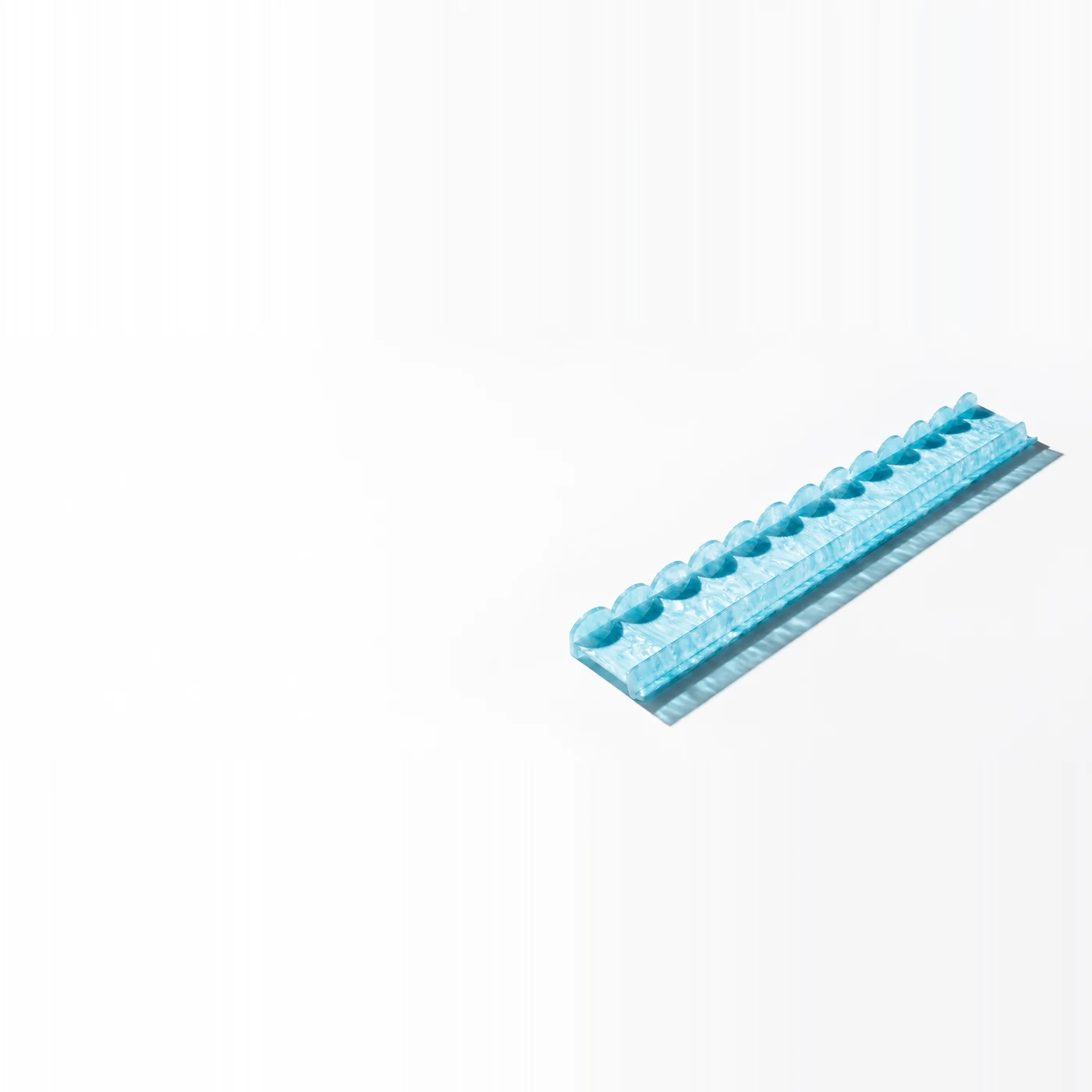 The Aqua Pearl Racks, Set of 4, four aqua blue acrylic mahjong racks with pearlescent swirls